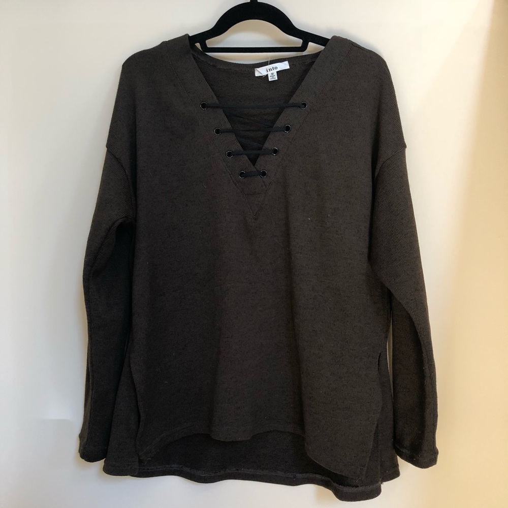 Brown sweater with black criss cross detail